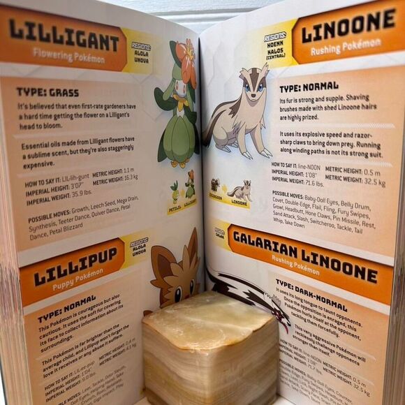 "Pokemon Adventures" and "Pokemon Super Extra Deluxe Essential Handbook" books - Picture 4 of 8